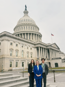 Photo of Dr. Webb and her lab researchers in front of the U.S. Capitol building. 