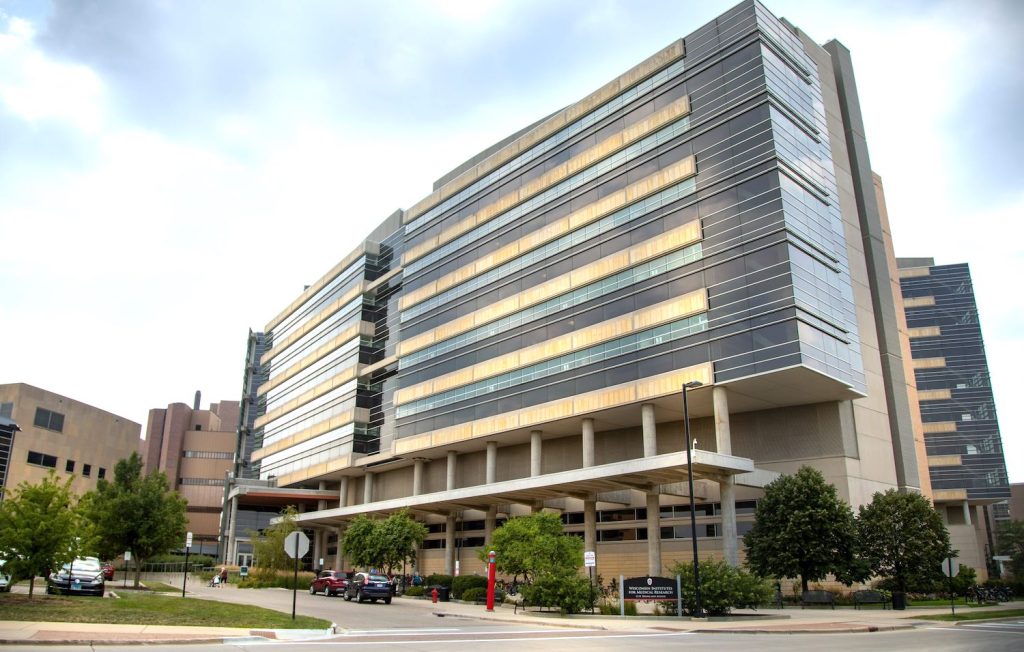 Photo of exterior of front entrance of the Wisconsin Institute for Medical Research (WIMR)