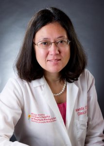 Dr. Wendy Chung with white coat and grey background